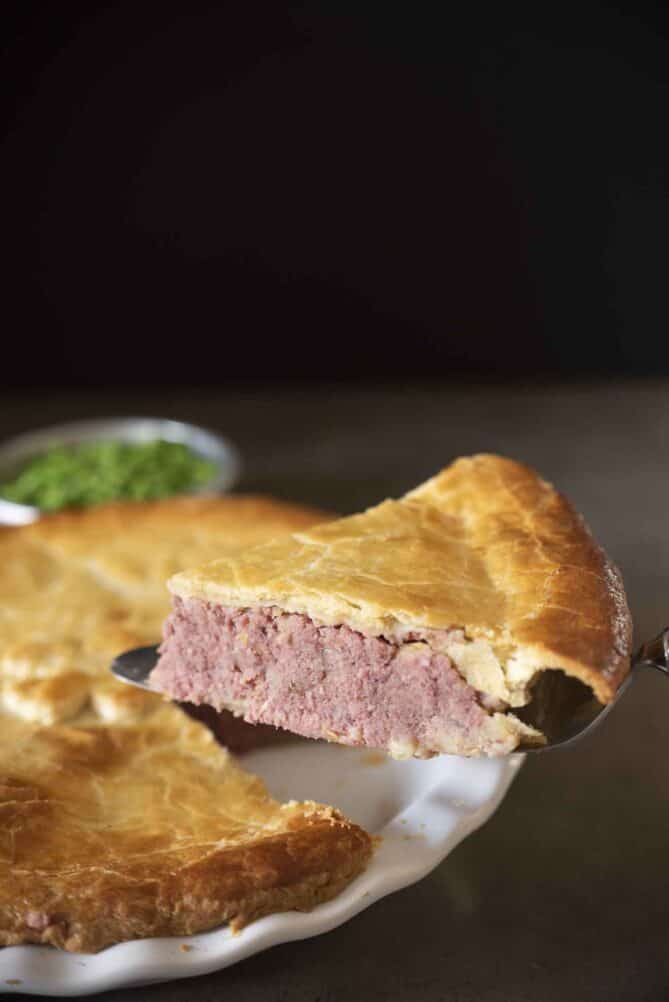 A slice of corned beef and potato pie