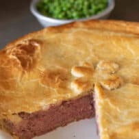 Corned beef and potato filled pie with browned crust