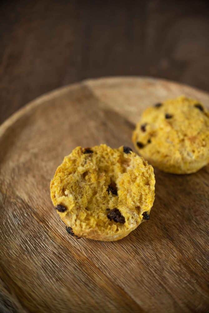 A pumpkin scone showing the fluffy inside with currants