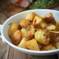 British roast potatoes - roasties fresh out of the oven in a serving dish