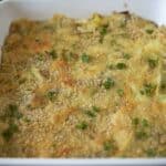 A crispy breadcrumb topping and chopped parsley on top of leeks in cheese sauce