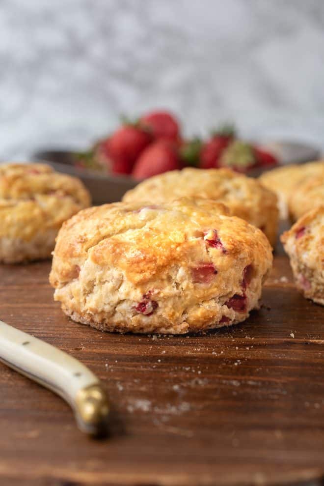 A side view of strawberry scones showing the chunks of fresh strawberries
