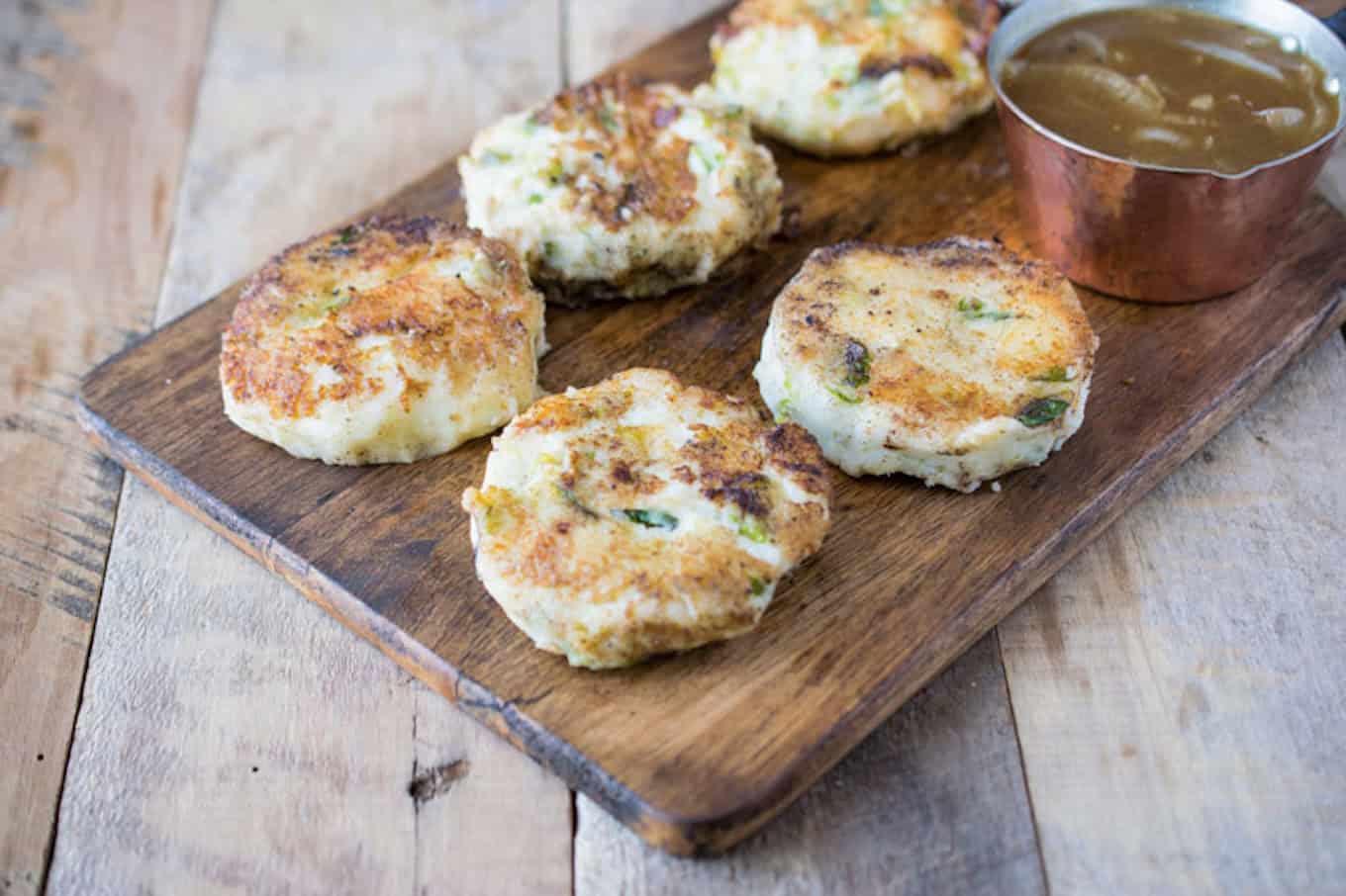 Potato patties on a board