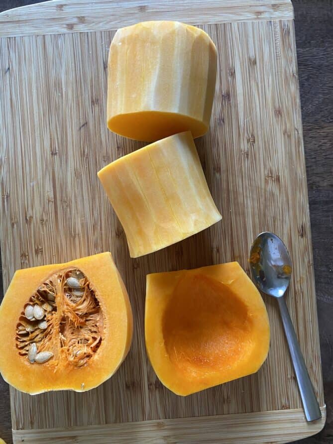Scraping the seeds out of a butternut squash