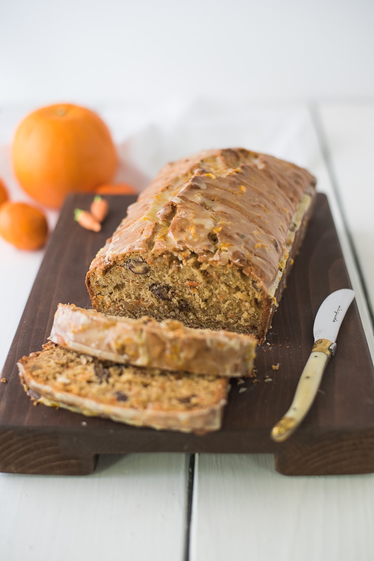Carrot ginger spiced bread on a cutting board sliced
