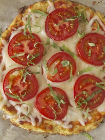 Cauliflower crust tomato basil pizza viewed from overhead