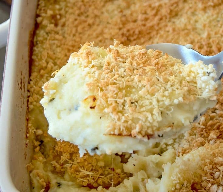 Creamy mashed potatoes topped with panko on a spoon