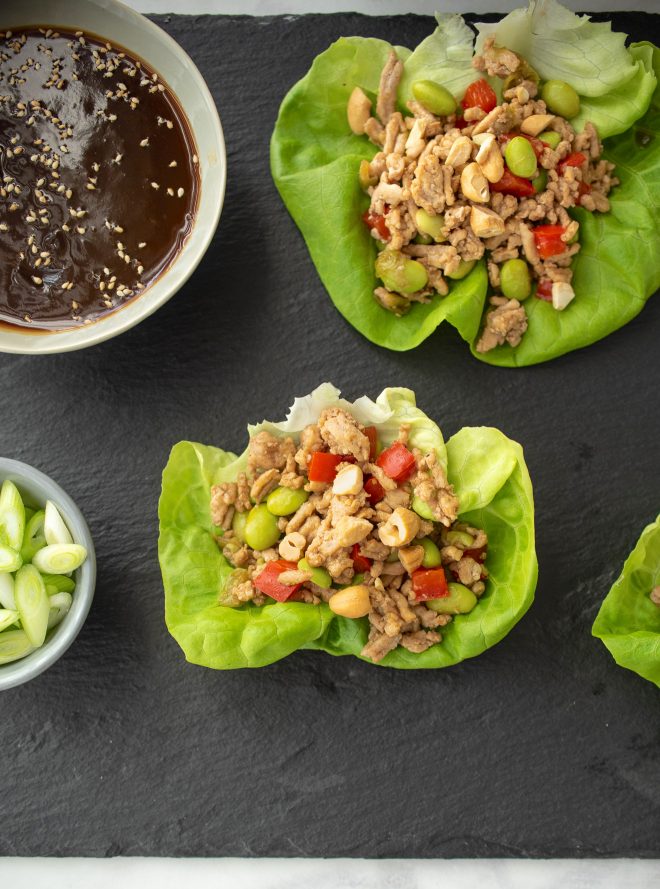 Ground chicken and vegetables in lettuce with orange sauce