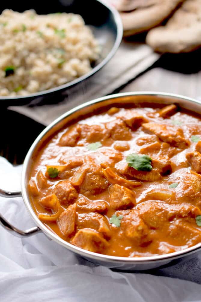 An Indian bowl filled with vibrant chicken tikka masala curry