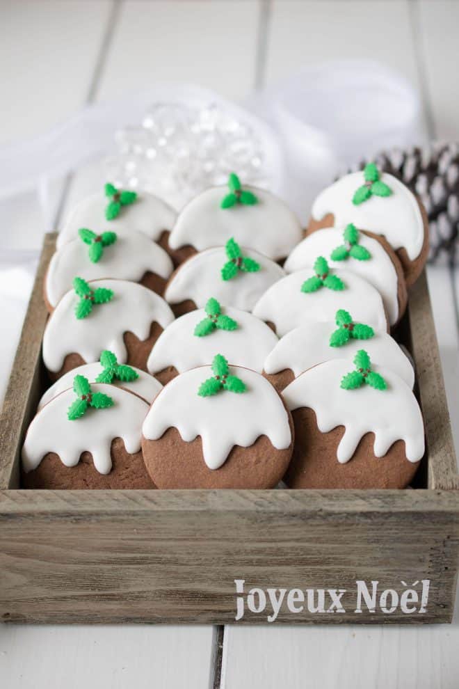 Chocolate cookies are decorated to look like a traditional Christmas pudding