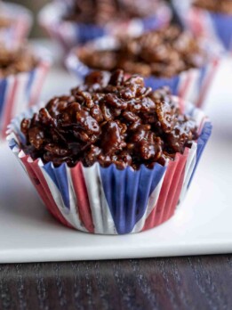 A closeup side view of a chocolate krispy cake
