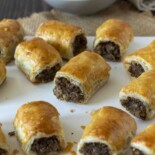 A selection of mushroom sausage rolls on a serving plate