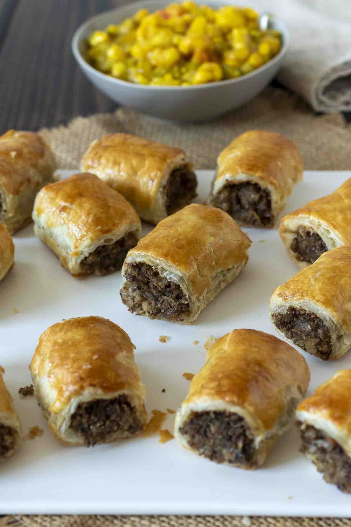 A selection of mushroom sausage rolls on a serving plate