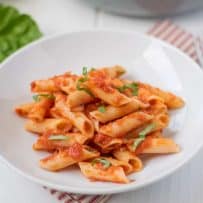 A white bowl filled with penne all'arrabbiata