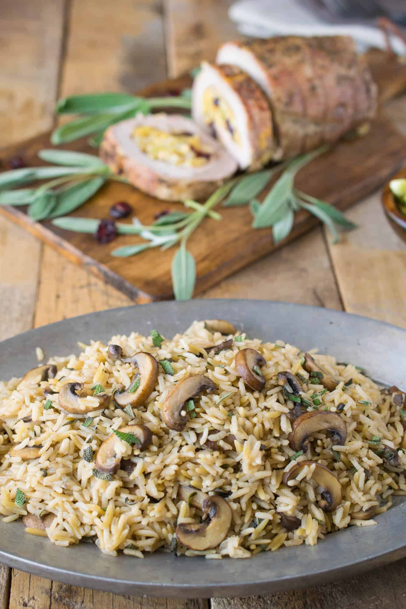 Mushroom sage rice pilaf on a sliver plate is the perfect side dish