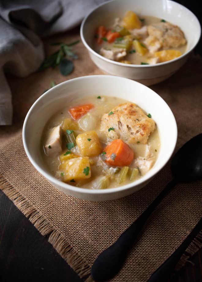 Colorful vegetables in a bowl of Creamy Chicken Stew with Sage and Chive Dumplings