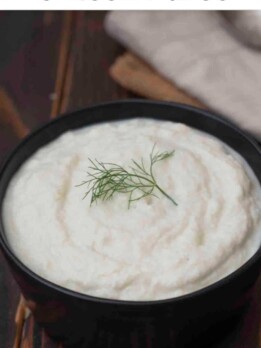 Creamy fennel and leek puree served in a ceramic bowl, garnished with a sprig of fennel franz