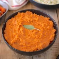 A bowl of vibrant orange sweet potato/yam mash