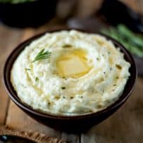 Creamy cauliflower mash made in the microwave topped with rosemary and melting butter
