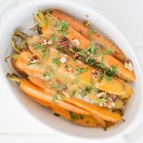Crockpot orange, honey and herb glazed carrots are a stunning side dish that will be a stunning addition to your holiday or Sunday dinner table.