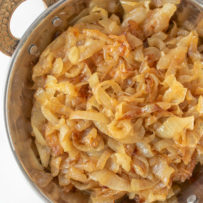 A closeup of curry caramelized onions showing the deep brown color