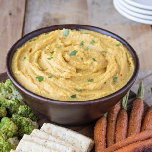 Curry roasted butternut squash and apple dip isa delicious coming together of two seasonal fruits and vegetables. Perfect for fall entertaining and served at room temperature with baked pita chips, roasted veggies or crackers.