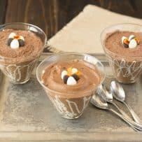 3 glass bowls of dark chocolate espresso mousse with 3 spoons