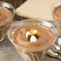 Dark chocolate espresso mousse in a glass bowl topped with white and dark chocolate