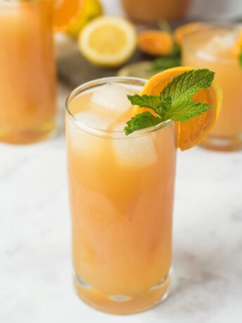 A brightly colored lemonade in a glass
