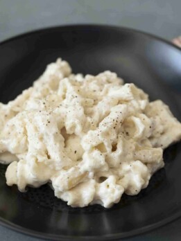 Large pasta coated in a creamy sauce