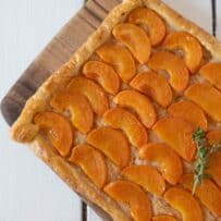 Sliced apricots on a rectangle puff pastry tart