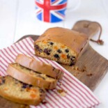 A sliced quick bread loaf with dried fruit