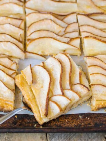 Pear tart on a baking sheet cut into squares