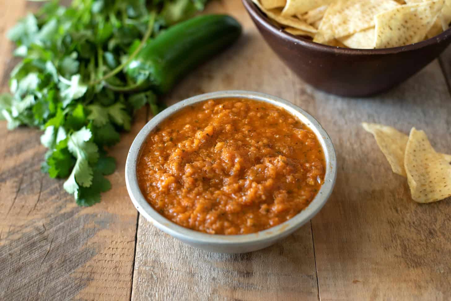 Red salsa in a grey bowl