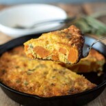 A slice of sweet potato frittata on a spatula