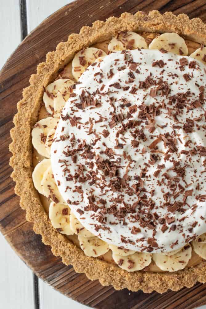 A fluted Graham cracker crust with toffee banana, cream and chocolate