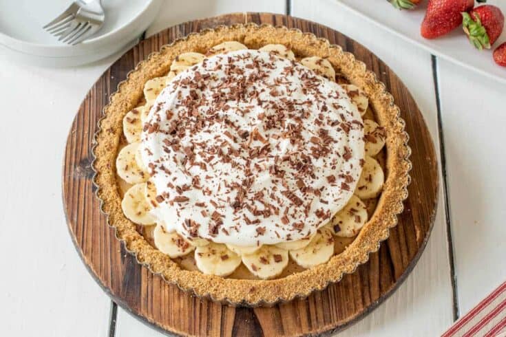A whole banoffee pie on a round board