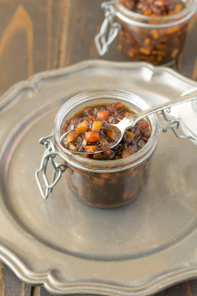 A spoon inside a jar of English pickle relish