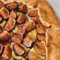 Juicy figs with melted brie cheese in a round pastry galette