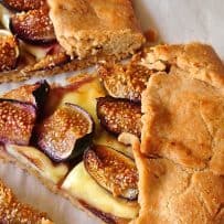 Shiny, juicy figs on melted brie and pastry