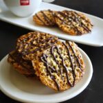 Chocolate drizzled lace cookies