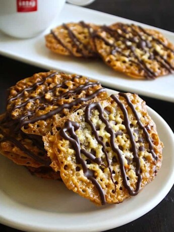 Chocolate drizzled lace cookies