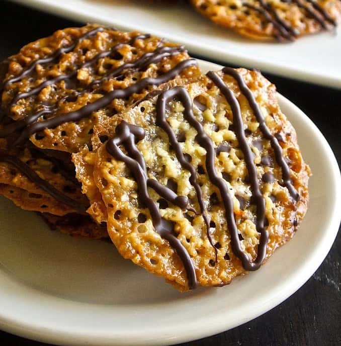 Florentine cookies are lace cookies made from  chopped almonds with orange & vanilla. They are then sandwiched with chocolate and you get the most delicious cookies.