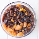 A bowl of dried fruit soaking in tea