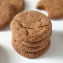 A tall stack of Ginger snaps ginger nuts cookies on a white plate