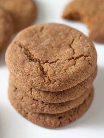 A tall stack of Ginger snaps ginger nuts cookies on a white plate
