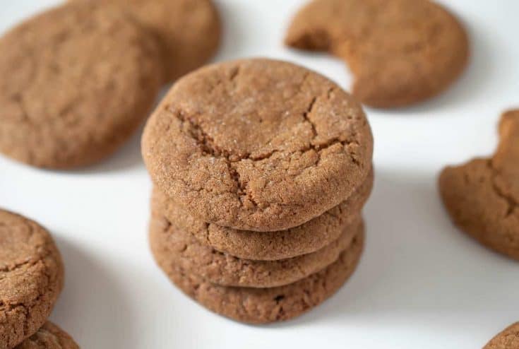 A tall stack of Ginger snaps ginger nuts cookies on a white plate