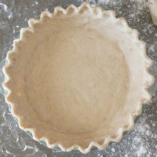A gluten free pie crust ready for the oven