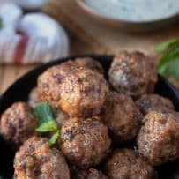 A closeup of Greek meatballs perfectly browned