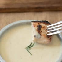 Creamy mustard sauce used as a dip for grilled chicken skewers